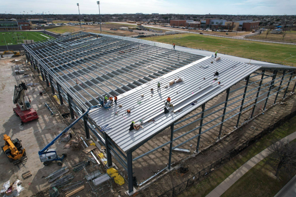 External view of construction frame of Timber Creek HS Indoor Extracurricular Program Facility.