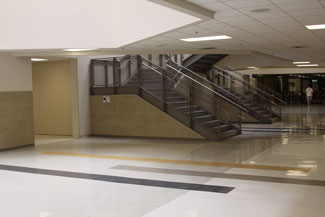 View from the bottom floor of central hallway where a  new staircase now stands where lockers once stood 